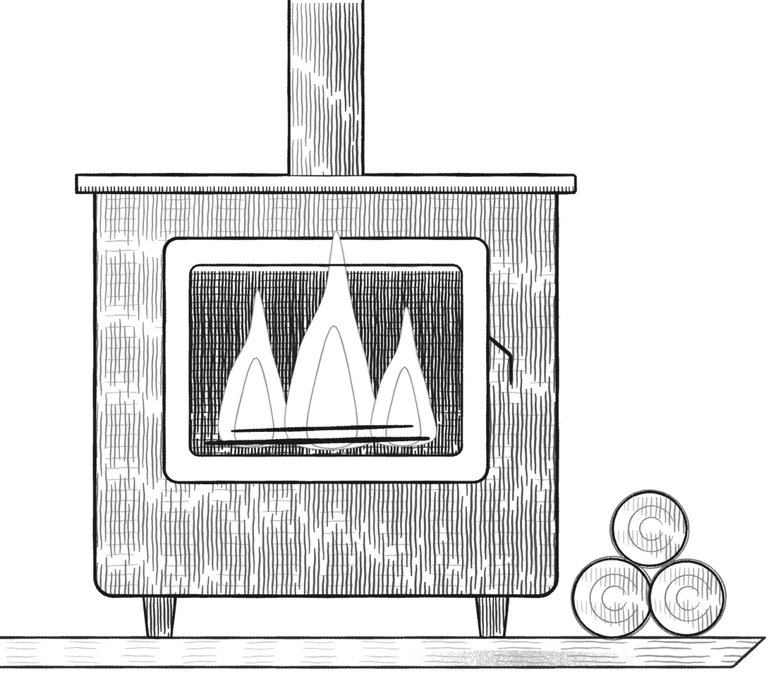 A wood-burning stove alight, with logs stacked beside it.