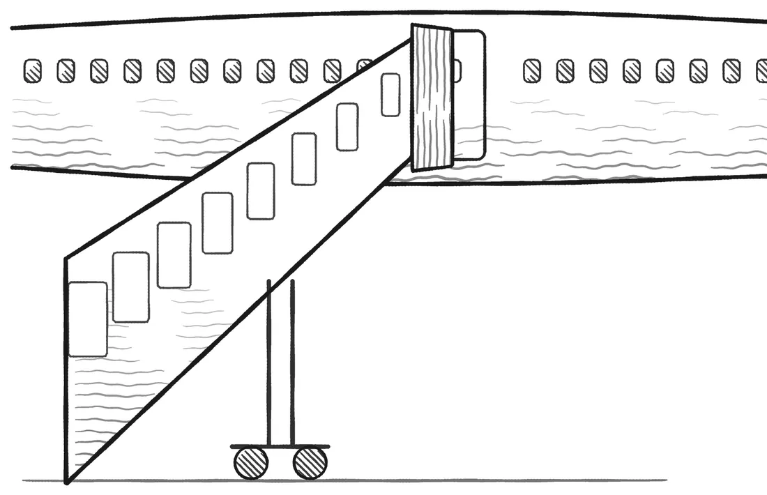 A boarding staircase raised to an aircraft’s open door.